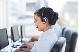 Attractive brunette working in a call centre