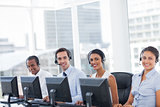 Line of call centre employees smiling