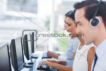 Line of agents working on computers