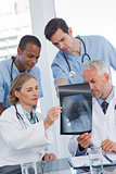 Serious medical team examining radiography