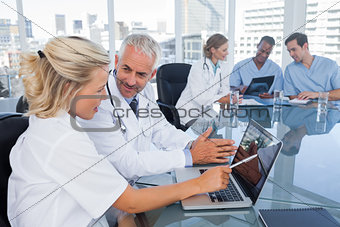 Two doctors with a laptop