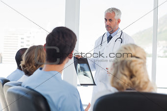 Doctor presenting x-ray