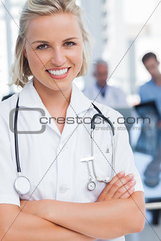 Young nurse with arms crossed