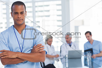Serious doctor with arms crossed