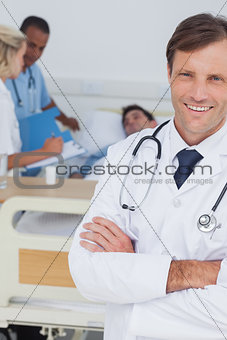 Smiling doctor looking at the camera