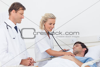 Doctor taking the heartbeat of her patient