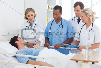 Medical team around the bed of a patient