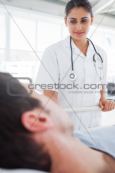 Smiling nurse taking care of a patient