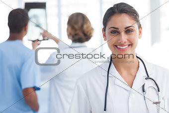 Young woman doctor looking at the camera