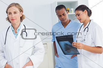 Doctor standing in front of medical team