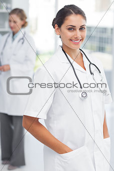 Doctor putting her hand in her pockets