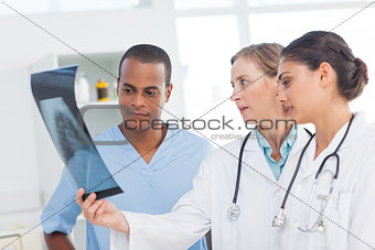 Medical team examining an x-ray