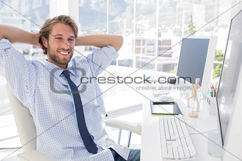 Smiling designer at his desk