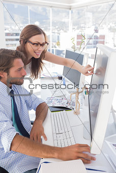 Editors reviewing photographs on computer