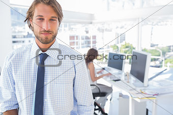 Portrait of smiling man in creative office