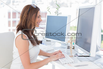Attractive designer working at computer