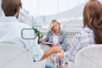 Therapist listening to couple during a session
