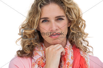 Blonde woman posing with her hand on her chin