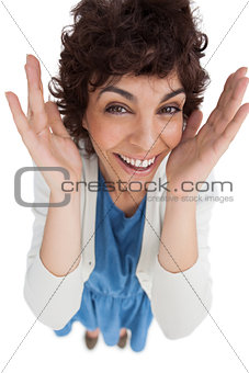 Overhead of surprised woman with hands wide opened