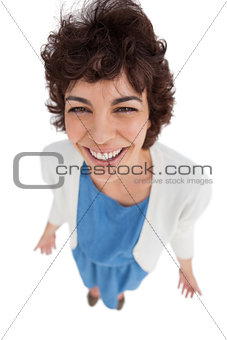 Overhead of cheerful woman standing alone