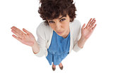 Overhead of a confused  woman gesturing