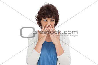 Brunette woman with hands on her mouth