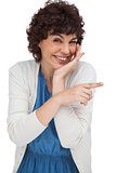 Smiling woman pointing something with her finger