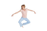 Woman jumping and opening arms
