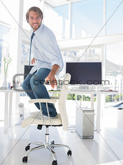 Man surfing his swivel chair