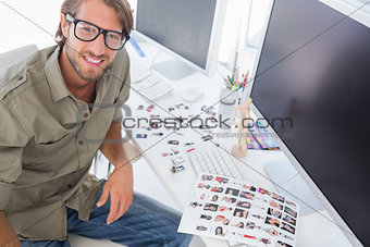 Photo editor at his desk