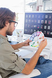 Editor looking at colour wheel