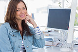 Cheerful designer smiling in creative office