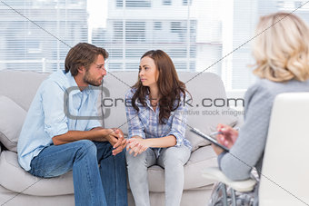 Couple looking to each other during therapy session
