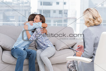 Young couple cuddling on the couch
