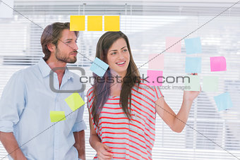 Young man and woman brainstorming together