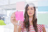 Woman checking sticky note