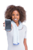 Cheerful woman showing her smartphone