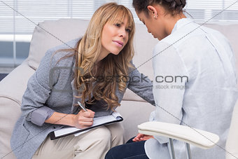 Therapist helping her patient
