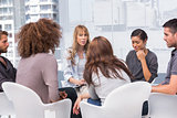 Woman crying during group therapy session