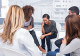 Woman getting distressed in group therapy