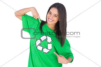 Enivromental activist pointing to the symbol on her tshirt