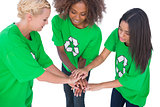 Three enviromental activists putting their hands together
