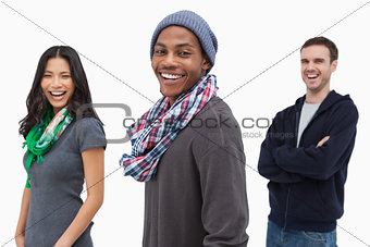 Laughing stylish young people in a row