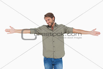 Man standing with arms outstretched