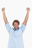 Happy man celebrating success with arms up