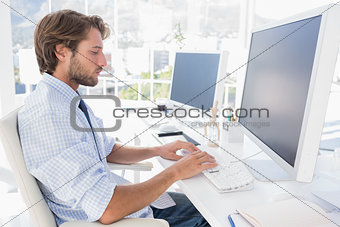 Designer sitting at his desk and working