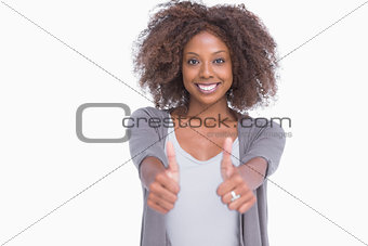 Happy woman giving thumbs up