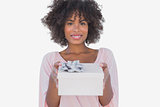 Happy woman holding a gift