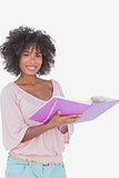 Beautiful woman holding photo album and smiling