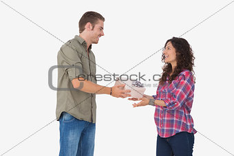 Man offering his friend a present